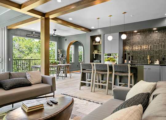 A modern living room with a large couch and a coffee table.