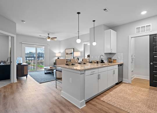 A kitchen with a countertop and cabinets is shown.