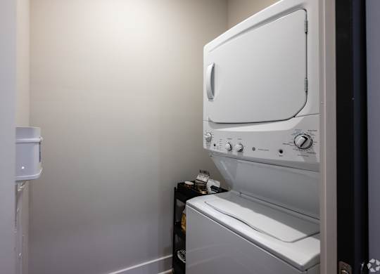 A white oven and microwave in a kitchen.
