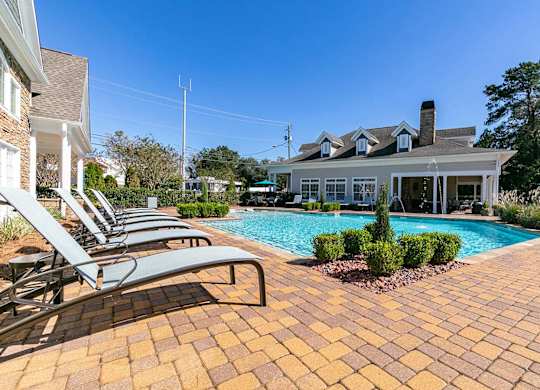 Lounge area surrounding pool at Magnolia Preserve in Dothan, AL