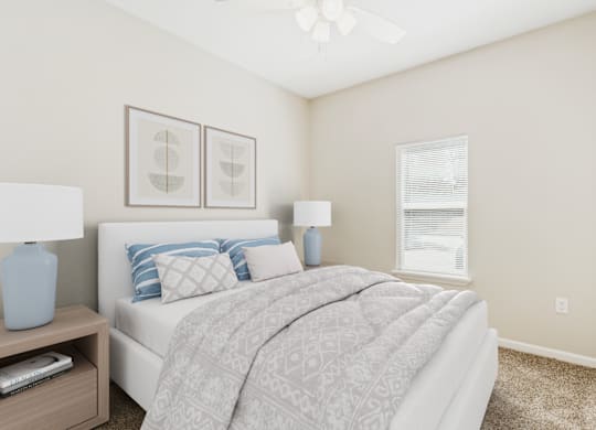 A bedroom with a bed, nightstand, and two framed pictures on the wall.