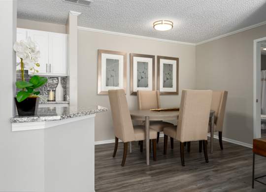 A dining room with wood-look flooring at Summerchase at Riverchase in Hoover, AL