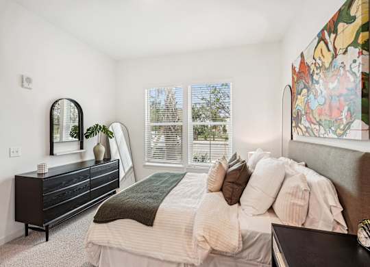 bedroom with two large windows at Tapestry University Park apartments in Sarasota, FL