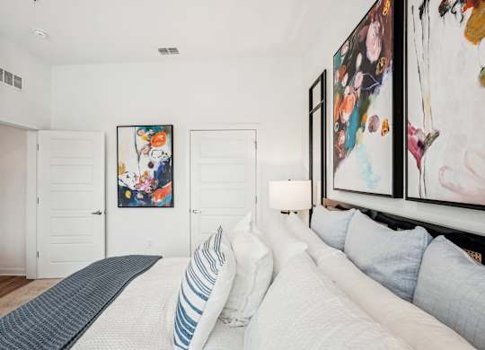 Primary bedroom with ensuite bathroom at Tapestry University Park apartments in Sarasota, FL