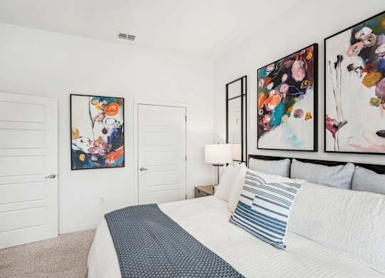 A bedroom with a large closet at Tapestry University Park apartments in Sarasota, FL