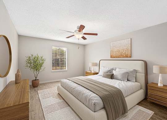 Oversized primary bedroom staged with a king size bed and two nightstands and dresser at Oakley at Hillcrest in west mobile, al