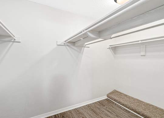 Large walk-in closet with built in shelving and rods at Oakley at hillcrest in west mobile, al