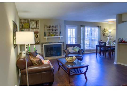 a living room with fireplace at at The Oakley at Hillcrest in Mobile, AL