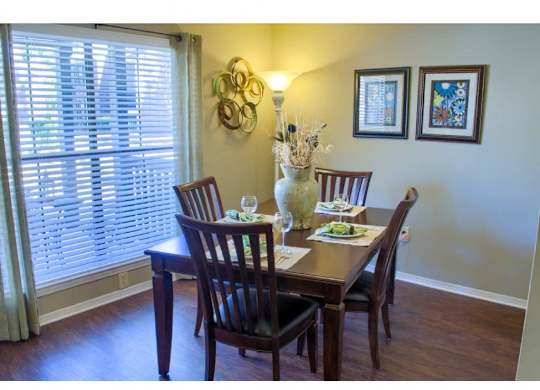 dining room with large window at Summit at at The Oakley at Hillcrest in Mobile, AL