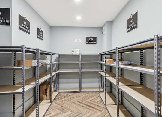 a room with bunk beds and shelving in it