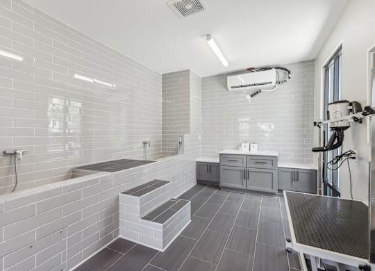 a white bathroom with a shower and a sink and a tub