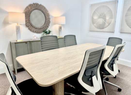 A conference room with a large table and chairs at Reserve of Foley Apartments in Foley AL
