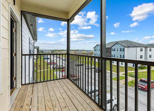 a balcony with a view of a parking lot