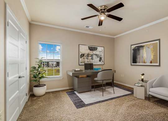 a home office with a ceiling fan