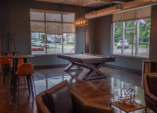clubroom with pool table and social area at Promenade at Founders Square Apartments in Indianapolis, IN