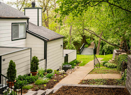 Apartment community with landscaping, greenspaces, hiking trails at Saddlebrook at Tates Creek Apartments in Lexington, KY
