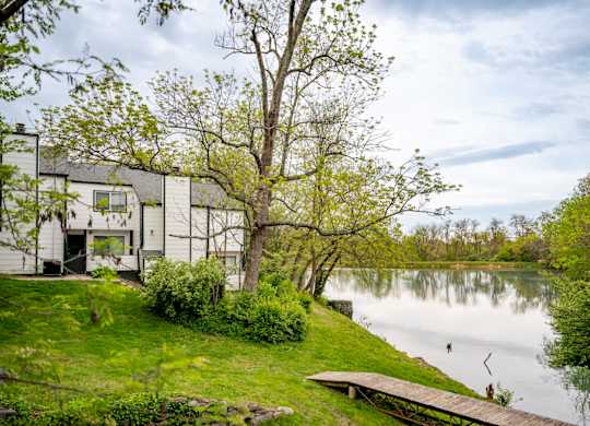 Apartment community with a lake views and walking trails at Saddlebrook at Tates Creek Apartments in Lexington, KY