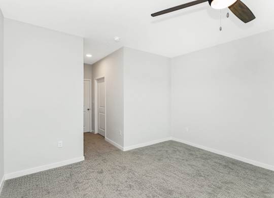 Spacious guest bedroom in the Coral Key floor plan at Southern at Santa Rosa