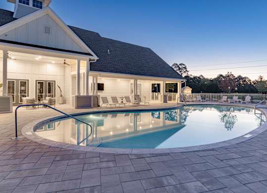 A house with a pool in the backyard.