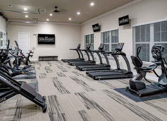 A gym with treadmills and elliptical machines Southern at Santa Rosa