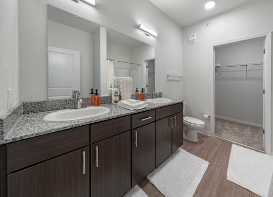 Primary bathroom with double vanity in the Coastal model floor plan
