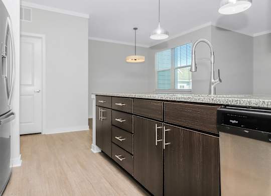 Kitchen island with lots of storage and a dishwasher Southern at Santa Rosa