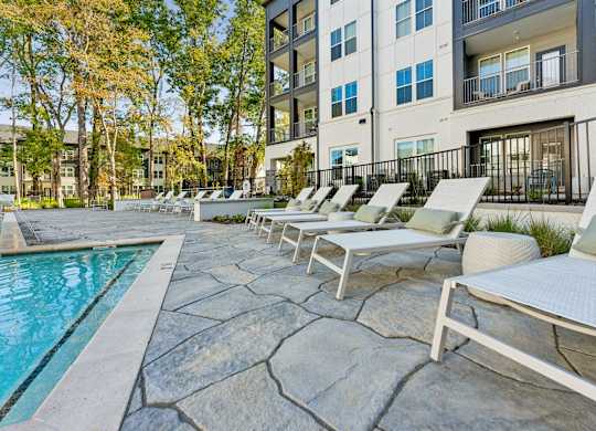 our apartments have a large pool and lounge chairs