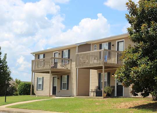 Building exterior with balcony at The Avery at Auburn Apartments in Auburn, AL