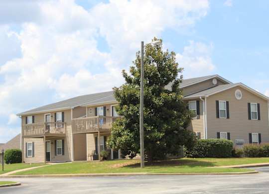 A large apartment building at The Avery at Auburn Apartments in Auburn, AL
