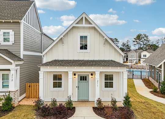 Exterior Cottage with blue door at Turnberry Park Apartments in Gardendale, AL