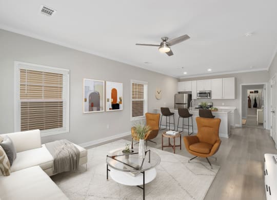 a living room with a couch and a table at The Cottages at Foley Farms apartments in Foley, AL