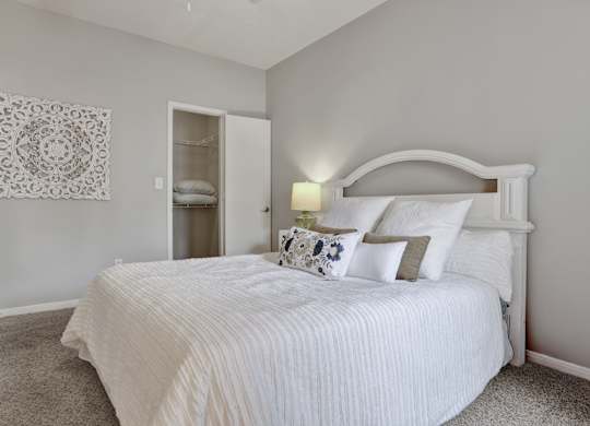 Bedroom and closet at Village at Caldwell Mill Apartments in Birmingham, AL