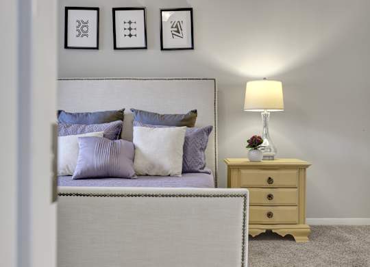 Bedroom with plush carpet Village at Caldwell Mill Apartments in Birmingham, AL