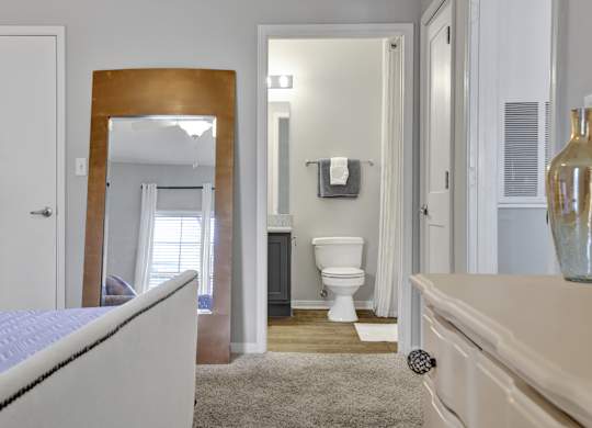 Bedroom with en-suite bathroom at Village at Caldwell Mill Apartments in Birmingham, AL