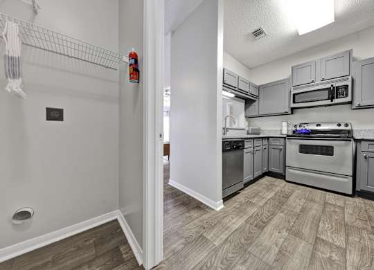 laundry room off of the kitchen at Village at Caldwell Apartments in Birmingham, AL