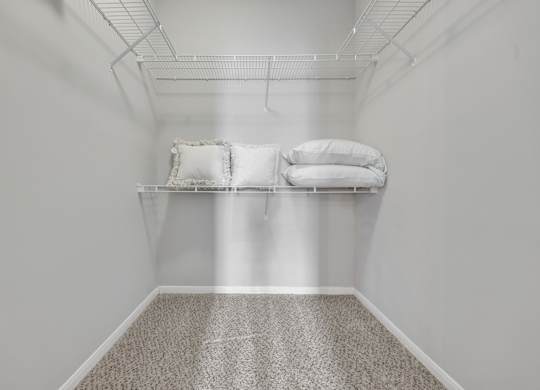 Walk-in closet at Village at Caldwell Apartments in Birmingham, AL