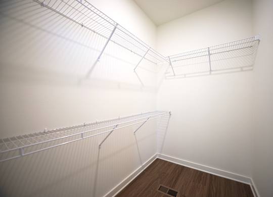 Walk-in closet with shelving at West Row Lofts and Townhomes in Birmingham, AL