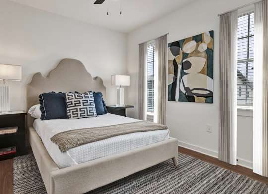 Bedroom with ceiling fan at West Row Townhomes and at West Row Townhomes at West Row Lofts and Townhomes in Birmingham, AL