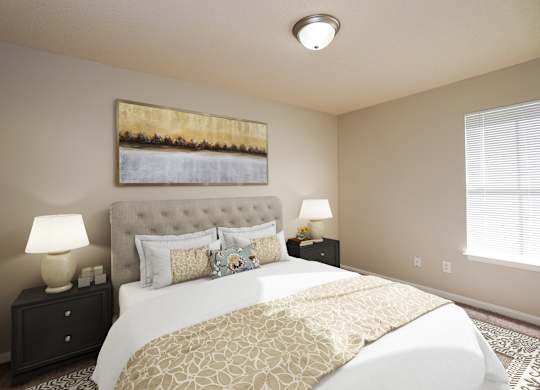 A bedroom with a large bed and a painting on the wall.