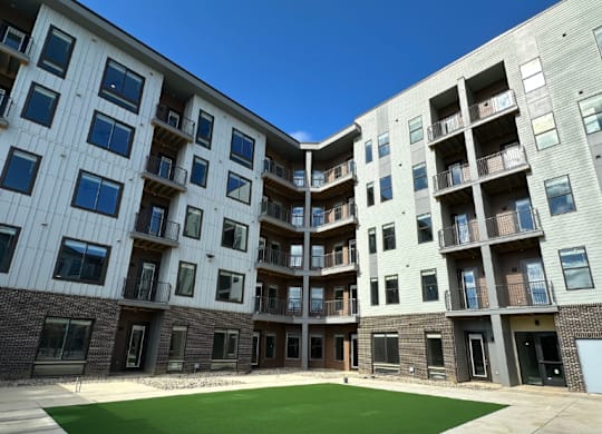 A yoga lawn is nestled in the courtyard of the Fitzroy apartment community in Birmingham, Alabama.