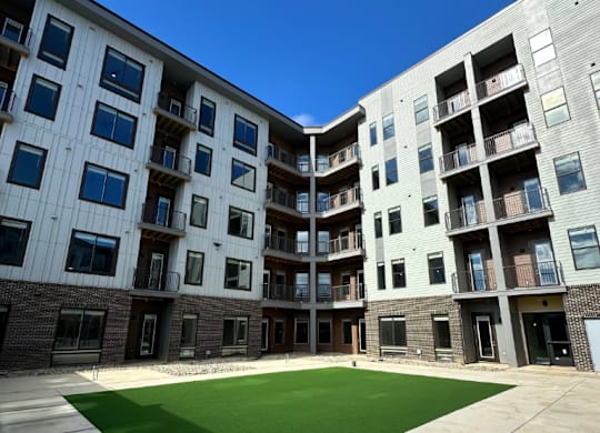 A yoga lawn is nestled in the courtyard of the Fitzroy apartment community in Birmingham, Alabama.
