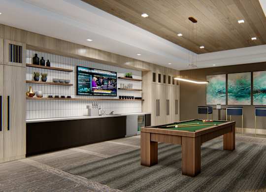 Resident lounge and game room with pool table at Zen City Center Troy, MI