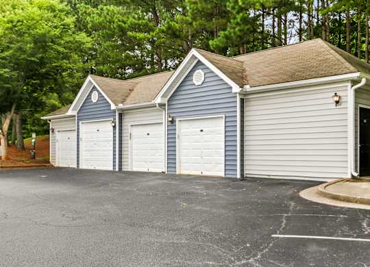 A two-story house with a garage on the side.