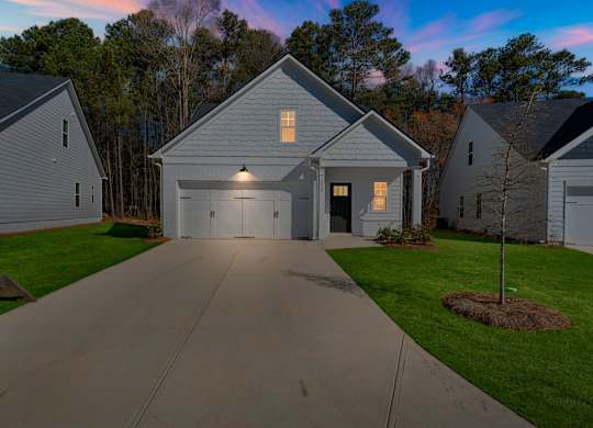 A house with a driveway in front of it.