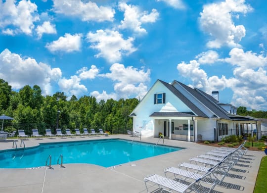 a swimming pool with a blue sky above it