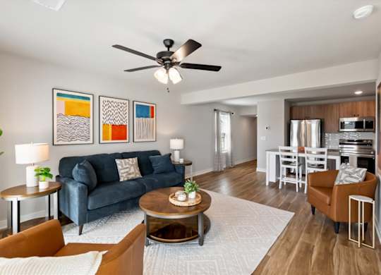 A living room with a blue couch and a coffee table.