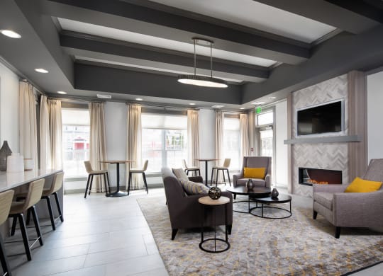 Resident lounge with fireplace and seating