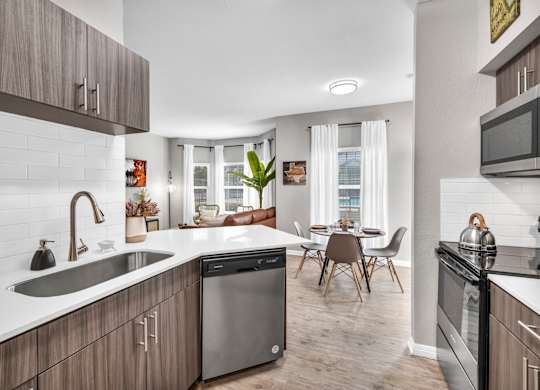 a kitchen and dining area in a 555 waverly unit