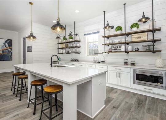 a kitchen with a large white counter top