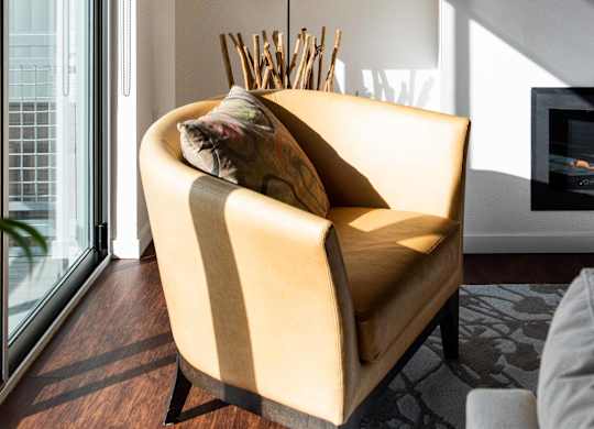Corner of living room with a chair and a lamp